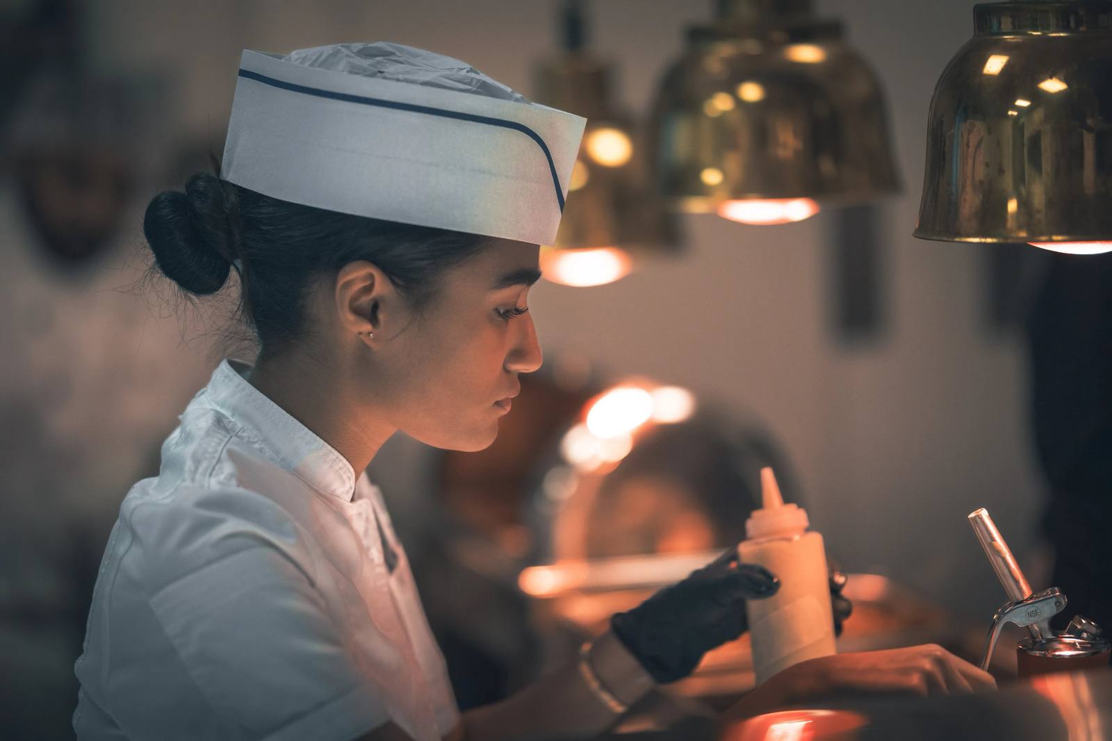 Fine-dining plates being prepared in a BHMS culinary kitchen
