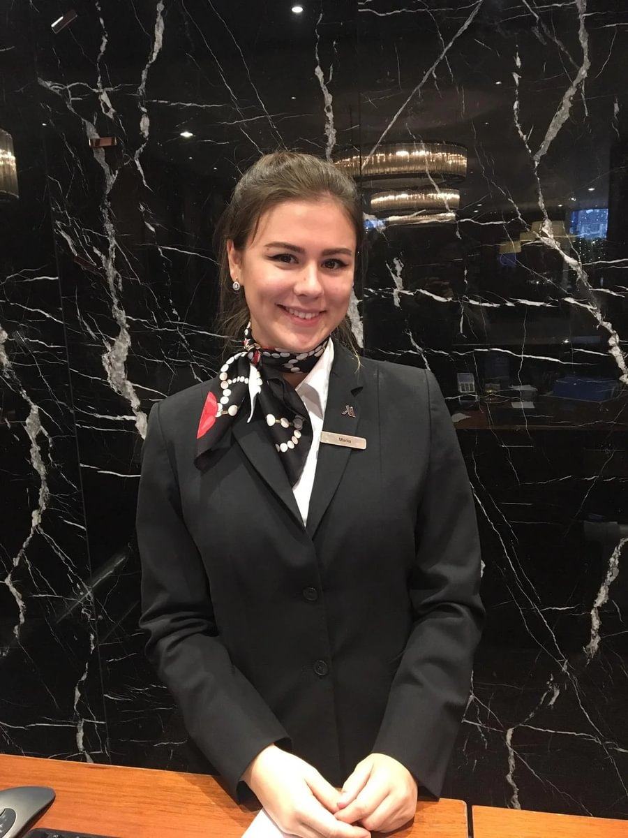 BHMS student working at a hotel front office desk during an industry placement